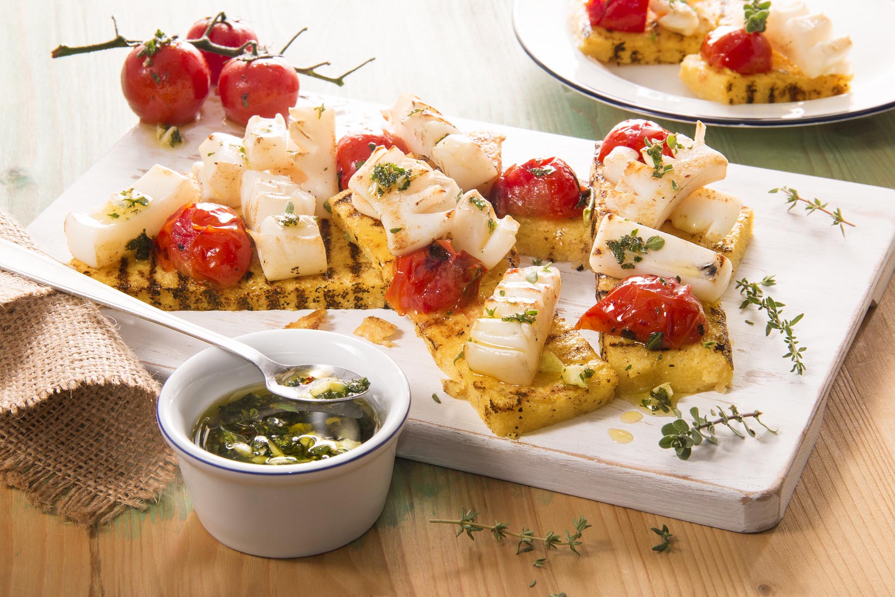 Grilled cuttlefish over rosemary polenta canapés - Ricetta - Polenta Valsugana